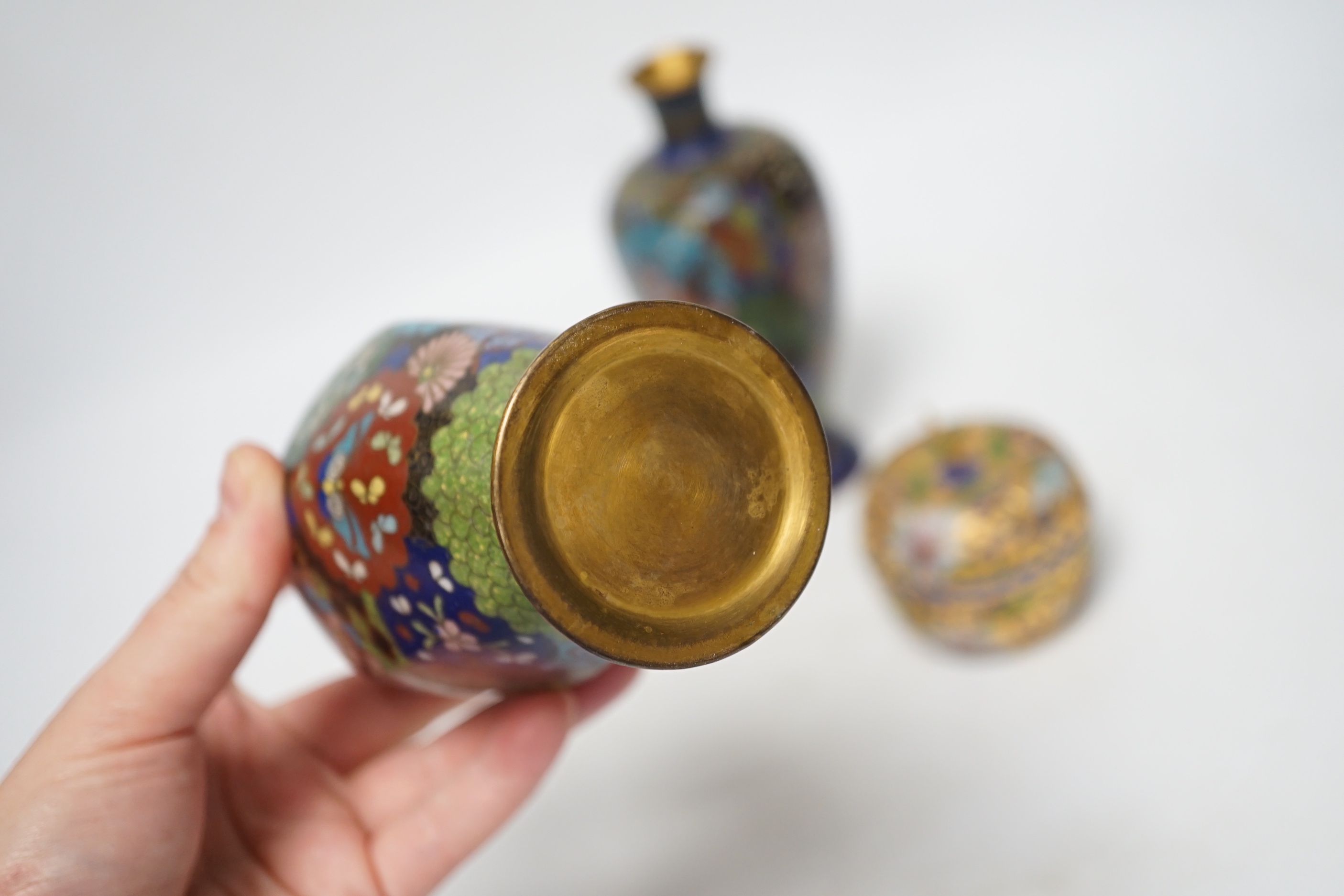 A pair of Chinese cloisonné enamel vases, similar Meiji period Japanese pot and cover and a pair of champleve ‘Apple’ boxes and covers, tallest 15cm